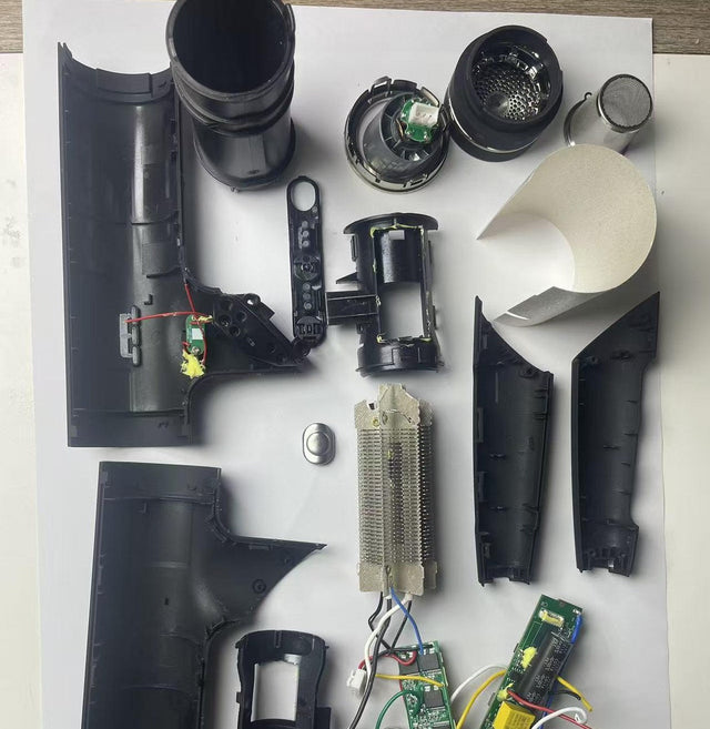 Lay-flat teardown view of a high-speed hair dryer: casing, finned heating element, brushless motor and impeller, main control board, thermal insulation sleeve and internal wiring harness