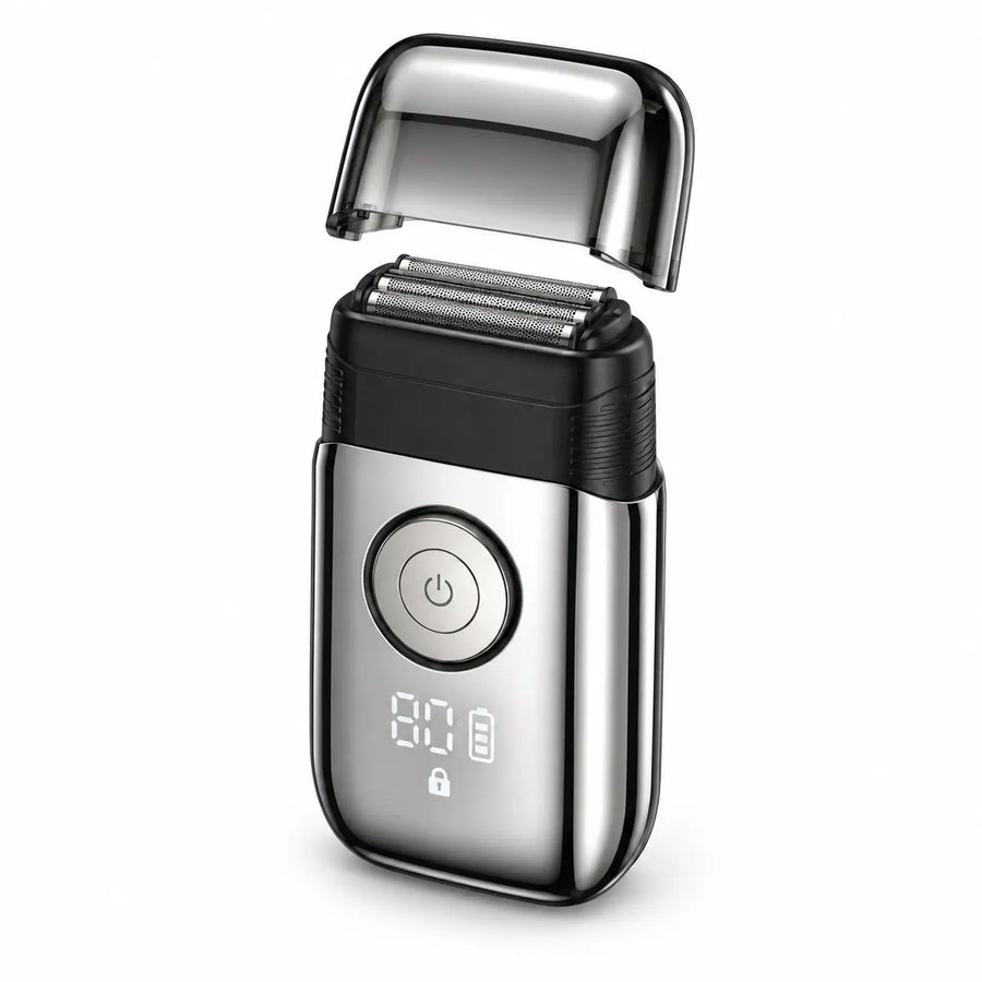 RYVO Model 9715 silver triple-foil reciprocating shaver on a white background